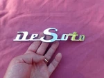 1950 Desoto Hood Emblem, Nos! 1335479. Fixed Price $149.99.
