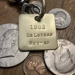 1982 De Lorean DMC-12 Brass Key Fob. Fixed Price $16.95.